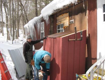 Building a cover for an outside oil tank.